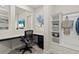 Home office featuring a built-in desk, shelving, and modern decor at 12139 Cranston Way, Bradenton, FL 34211