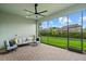 Screened-in patio with comfortable seating, offering views of the beautifully landscaped backyard at 12139 Cranston Way, Bradenton, FL 34211