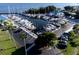 High angle view of the marina with sailboats docked in slips, surrounded by parking, palm trees, and green spaces at 1505 43Rd Avenue W Dr, Palmetto, FL 34221