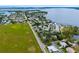 Panoramic aerial view of a waterfront neighborhood with homes, landscaping, and nearby Tampa Bay at 1505 43Rd Avenue W Dr, Palmetto, FL 34221