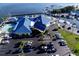 Aerial view of the marina clubhouse with a pool, parking, and docks with sailboats on the water at 1505 43Rd Avenue W Dr, Palmetto, FL 34221
