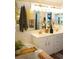 Bathroom featuring a double vanity with a large mirror, and a relaxing soaking tub at 1505 43Rd Avenue W Dr, Palmetto, FL 34221