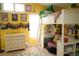 Cheerful bedroom with playful decor, yellow walls and a unique loft bed at 1505 43Rd Avenue W Dr, Palmetto, FL 34221