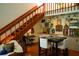 Stylish dining area with hardwood floors, a modern table setting, and unique wall decor at 1505 43Rd Avenue W Dr, Palmetto, FL 34221