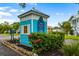 Entrance to Heritage Bay, a private community, featuring a welcoming blue and white guardhouse with lush landscaping at 1505 43Rd Avenue W Dr, Palmetto, FL 34221