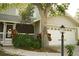 Well-maintained home showcasing a two-car garage, charming front porch and attractive landscaping at 1505 43Rd Avenue W Dr, Palmetto, FL 34221