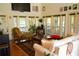 Bright living room with hardwood floors, multiple windows, and comfortable seating arrangement at 1505 43Rd Avenue W Dr, Palmetto, FL 34221