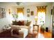 Cozy living room featuring a comfortable sofa, hardwood floors, and bright natural light at 1505 43Rd Avenue W Dr, Palmetto, FL 34221