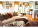 Stylish living room featuring a comfortable sofa, hardwood floors, and mirrored wall at 1505 43Rd Avenue W Dr, Palmetto, FL 34221