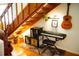 Charming nook with hardwood floors, a piano, guitar, and curated wall decor at 1505 43Rd Avenue W Dr, Palmetto, FL 34221