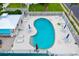 Aerial view of community pool with lounge chairs and umbrellas at 1505 43Rd Avenue W Dr, Palmetto, FL 34221