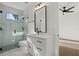Bathroom features glass shower, vanity with quartz countertop, undermount sink, and black hardware at 1605 Landfall Dr, Nokomis, FL 34275