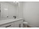 Bathroom features vanity with quartz countertop, undermount sink, and black hardware at 1605 Landfall Dr, Nokomis, FL 34275
