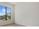 Bedroom features a large window overlooking the exterior at 1605 Landfall Dr, Nokomis, FL 34275