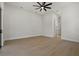 Bedroom features doorway, base trim, ceiling fan and natural light at 1605 Landfall Dr, Nokomis, FL 34275