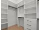 This closet features custom shelving and storage drawers at 1605 Landfall Dr, Nokomis, FL 34275