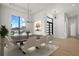 Elegant dining room featuring modern chandelier, decorative rug, and views of front yard from the large window at 1605 Landfall Dr, Nokomis, FL 34275