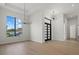 Living room with a modern chandelier and a view of the outside at 1605 Landfall Dr, Nokomis, FL 34275