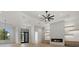 Open-concept room with sleek fireplace and light fixtures at 1605 Landfall Dr, Nokomis, FL 34275