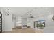 Bright, modern living room featuring a fireplace, recessed lighting, and a sliding glass door at 1605 Landfall Dr, Nokomis, FL 34275