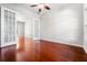 Spacious bedroom boasts hardwood floors and double doors leading to another room at 1711 145Th E St, Sarasota, FL 34212