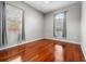 Bright bedroom with hardwood floors, neutral walls, and a ceiling fan at 1711 145Th E St, Sarasota, FL 34212