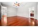Bedroom featuring hardwood floors, neutral paint colors, and access to ensuite bath and walk-in closet at 1711 145Th E St, Sarasota, FL 34212