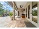 Outdoor patio area features brick pavers, ceiling fan, and a beautiful waterfall feature at 1711 145Th E St, Sarasota, FL 34212