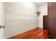 Walk-in closet is equipped with shelving and hardwood floors, offering great storage solutions at 1711 145Th E St, Sarasota, FL 34212
