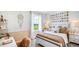 Charming bedroom with a gallery wall, decorative pillows, and a cozy atmosphere at 17904 Tavernside Trl, Bradenton, FL 34211