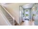 Inviting foyer with tile flooring, stairway, and a glass-paneled door to let in natural light at 17904 Tavernside Trl, Bradenton, FL 34211