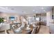 Open concept living and kitchen area with modern design, neutral colors, and plenty of natural light at 17904 Tavernside Trl, Bradenton, FL 34211