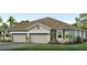 Charming single-story home with a two-car garage and well-maintained landscaping at 18051 Cropside Trl, Lakewood Ranch, FL 34211