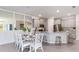 Eat-in kitchen featuring modern cabinets, stainless appliances, marble countertops, and barstool seating at 18051 Cropside Trl, Lakewood Ranch, FL 34211