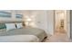 Relaxing bedroom with art and view into the hallway at 18324 Cropside Trl, Lakewood Ranch, FL 34211