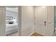 View of the front door as it opens to a bedroom; the floors are wood-look vinyl at 18324 Cropside Trl, Lakewood Ranch, FL 34211