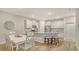 Beautiful kitchen with white cabinetry, granite countertops, stainless steel appliances, and a dining area at 18324 Cropside Trl, Lakewood Ranch, FL 34211