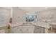Modern kitchen island with granite countertop and stainless steel dishwasher with view to living room at 18324 Cropside Trl, Lakewood Ranch, FL 34211