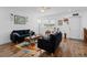 Comfortable living room with hardwood floors, bright natural light, and inviting seating arrangements at 202 Bedford Trl # 120, Sun City Center, FL 33573