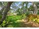 The backyard provides lush greenery, shade and mature trees that create a peaceful outdoor setting at 2204 67Th W St, Bradenton, FL 34209
