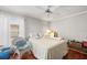 Serene bedroom with a ceiling fan, hardwood floors, and a lot of natural light at 2204 67Th W St, Bradenton, FL 34209