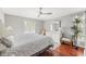 Cozy bedroom features a ceiling fan and large window with lots of natural light at 2204 67Th W St, Bradenton, FL 34209