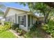 A side view of the house with lush landscaping around the perimeter at 2204 67Th W St, Bradenton, FL 34209