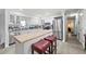 Bright kitchen features stainless steel appliances and a butcher block island with seating at 2204 67Th W St, Bradenton, FL 34209