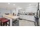 Bright kitchen featuring white cabinets, stainless steel appliances and a butcher block island at 2204 67Th W St, Bradenton, FL 34209
