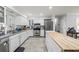 Bright kitchen features stainless steel appliances, granite counters and ample cabinet space at 2204 67Th W St, Bradenton, FL 34209