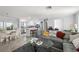 Open living area featuring tile floors, neutral paint, and an open flow to the kitchen at 2204 67Th W St, Bradenton, FL 34209