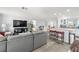 An open-concept living space featuring a modern kitchen with bar seating and a comfortable seating area, perfect for entertaining at 2204 67Th W St, Bradenton, FL 34209