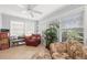 Bright sunroom with large windows, tile flooring, and comfortable seating, perfect for relaxation and enjoying natural light at 2204 67Th W St, Bradenton, FL 34209