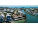 Beautiful waterfront property with dock and lush landscaping on canal at 236 S Harbor Dr, Holmes Beach, FL 34217